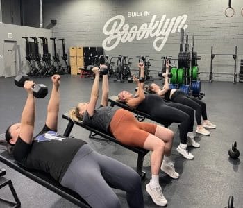 womans lift weight on bench
